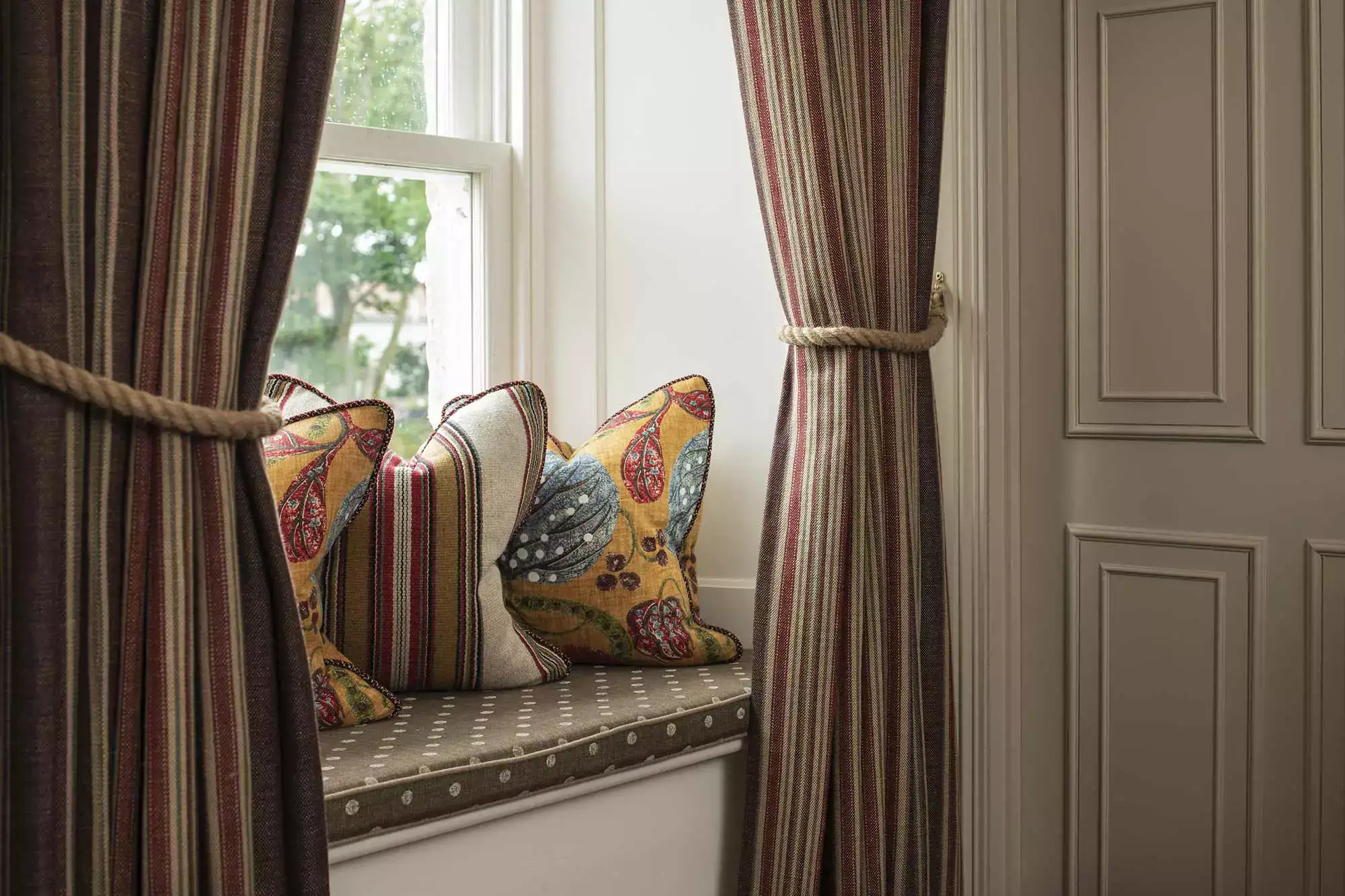 Windowsill with three cushions on top