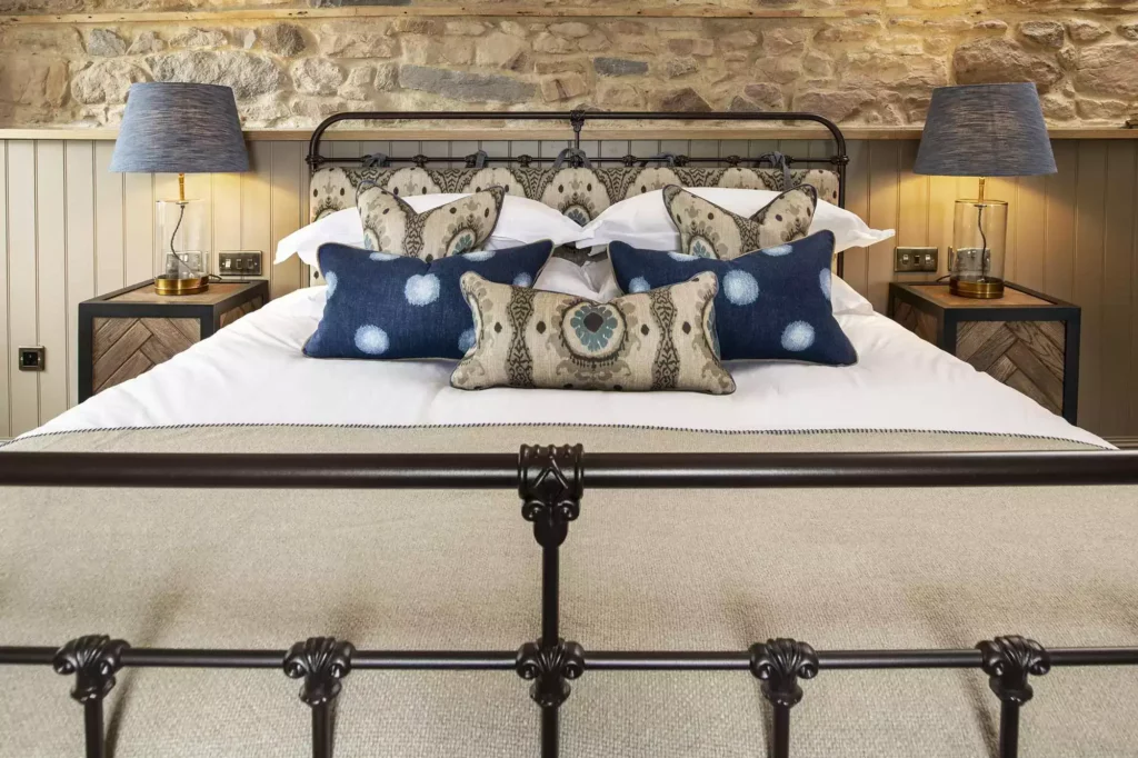 Double bed with blue and cream cushions