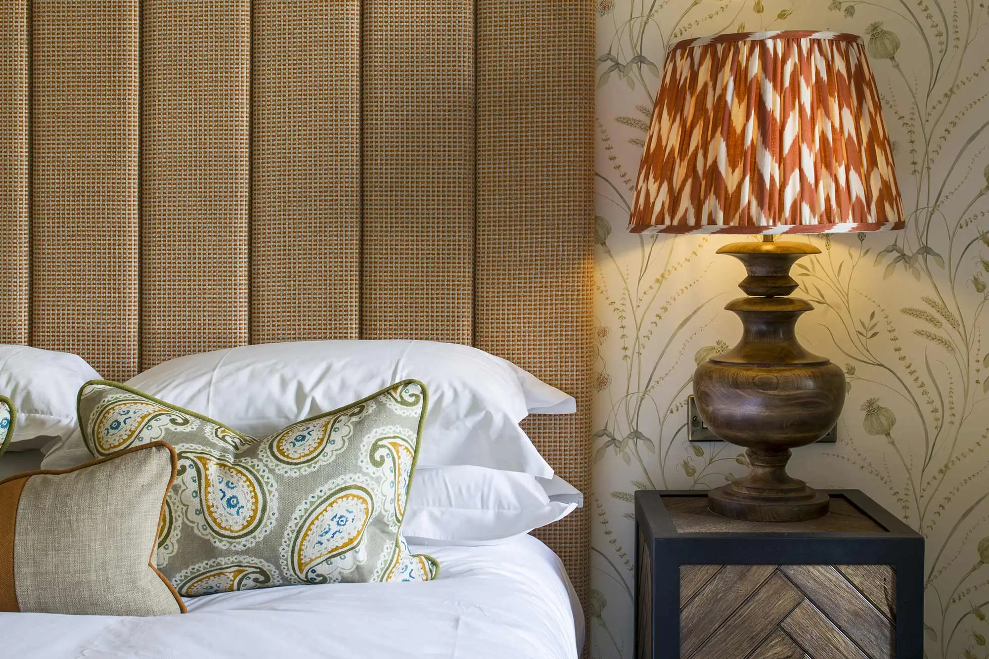 Bed with an orange and white lamp