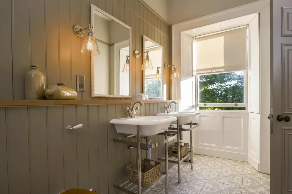 Bathroom with two sinks and two mirrors